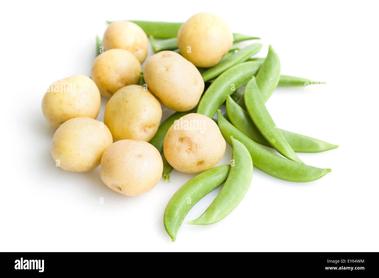 Fresh potatoes and pea pods Stock Photo