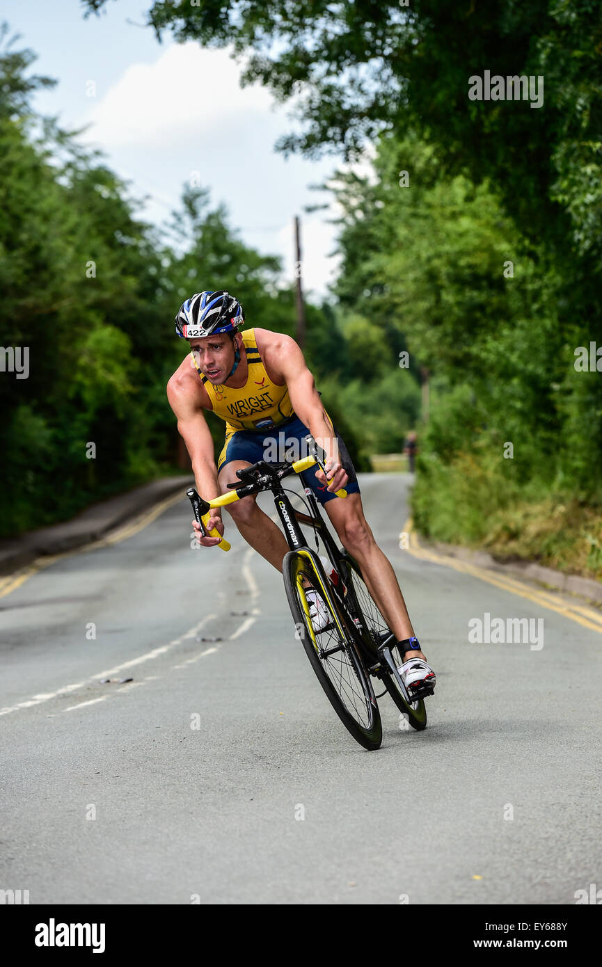 Team BAR Triathlete Mathew Wright on the bike split during the 2015 Jenson Button Trust Triathlon in aid of Cancer Research Stock Photo