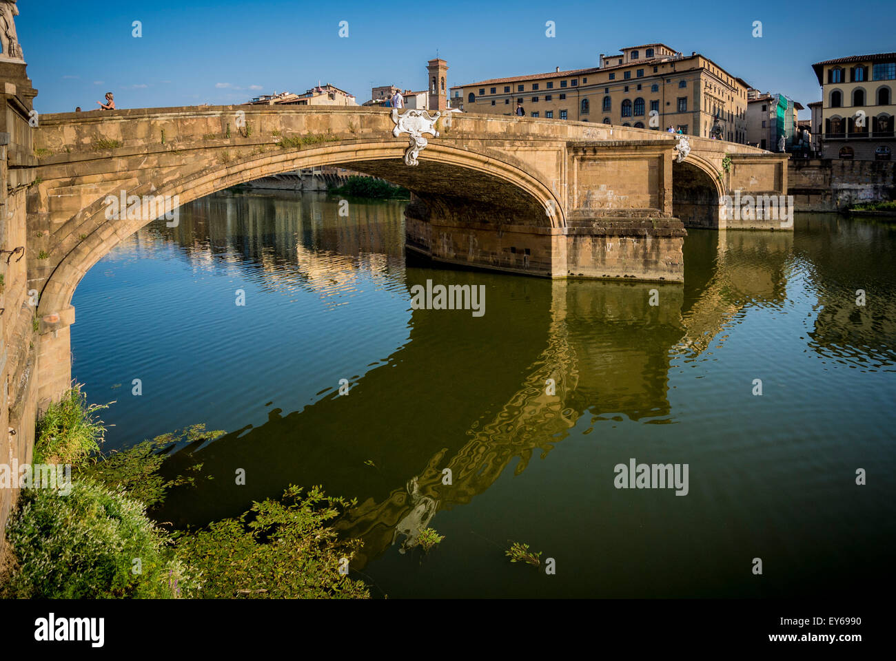 Ponte Santa Trinita and river Arno. Florence, Italy. The Ponte Santa Trìnita is the oldest elliptic arch bridge in the world. Stock Photo