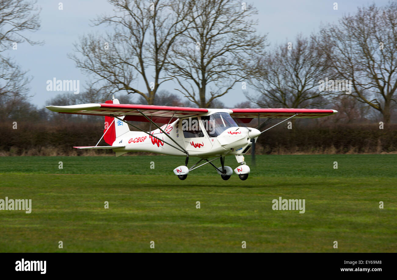 Ikarus C42 FB UK G-CBGP landing at Breighton Airfield Stock Photo