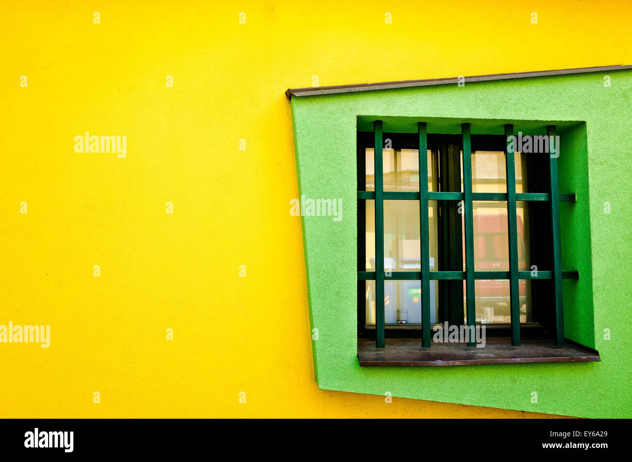 modern building in yellow walls and green windows Stock Photo
