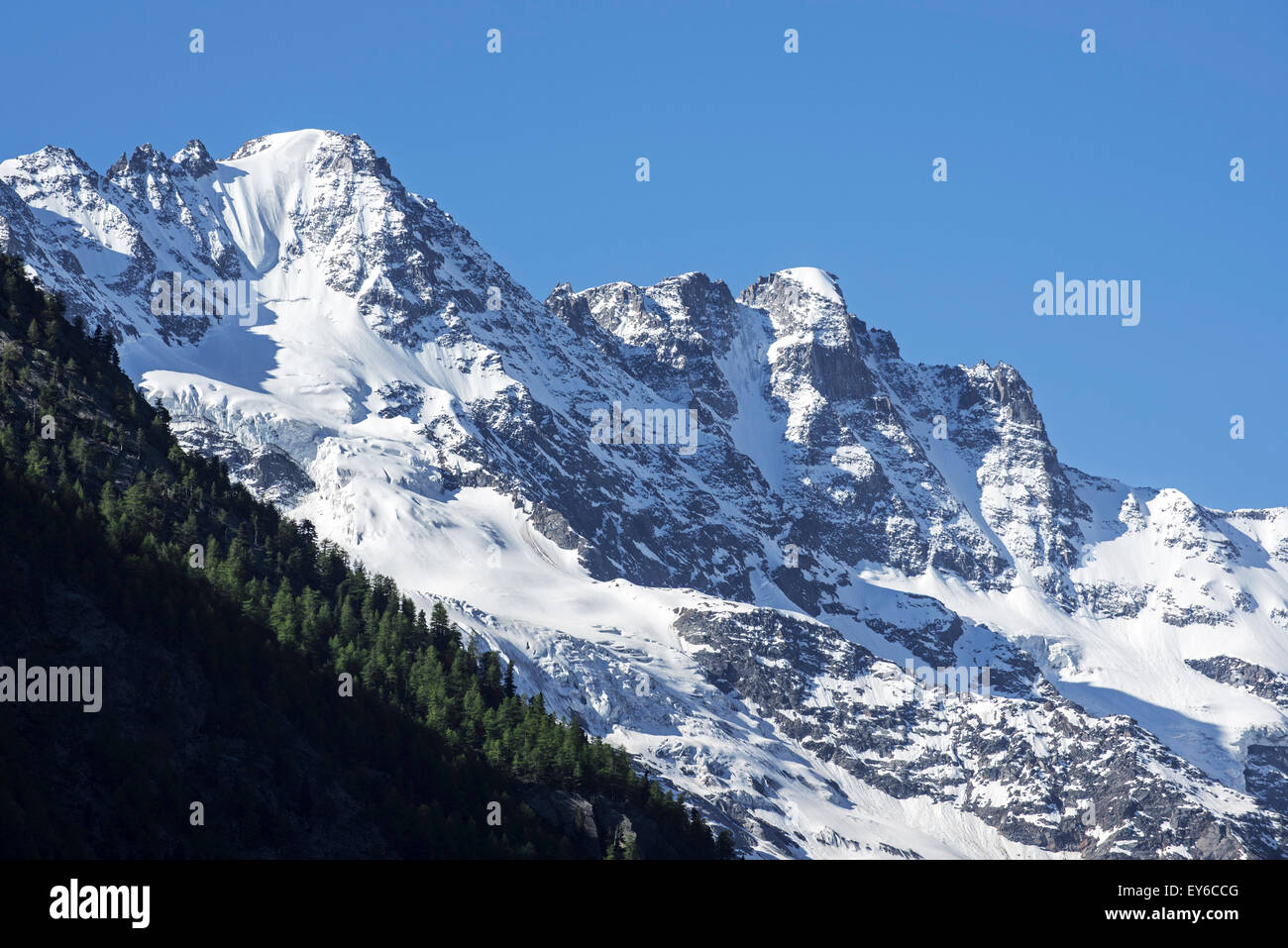 Snow covered mountain Gran Paradiso seen from Cogne in the Graian Alps, Italy Stock Photo