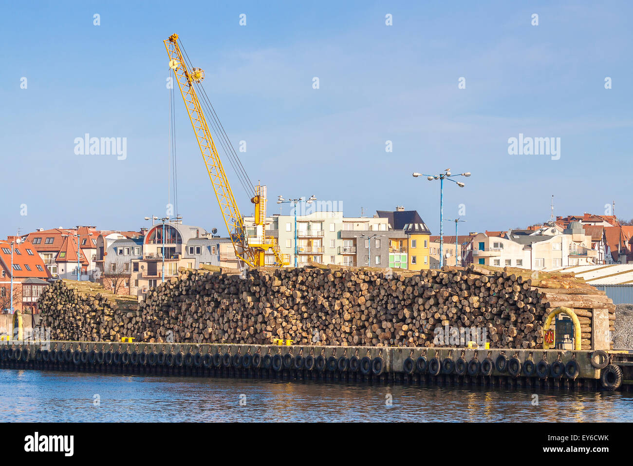 Wood logs and crane in port of Kolobrzeg, Poland Stock Photo Alamy