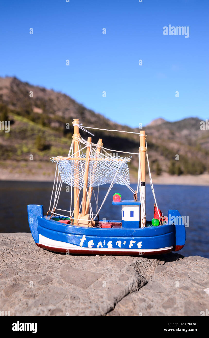 Blue Fishing Boat Figurine Stock Photo - Alamy