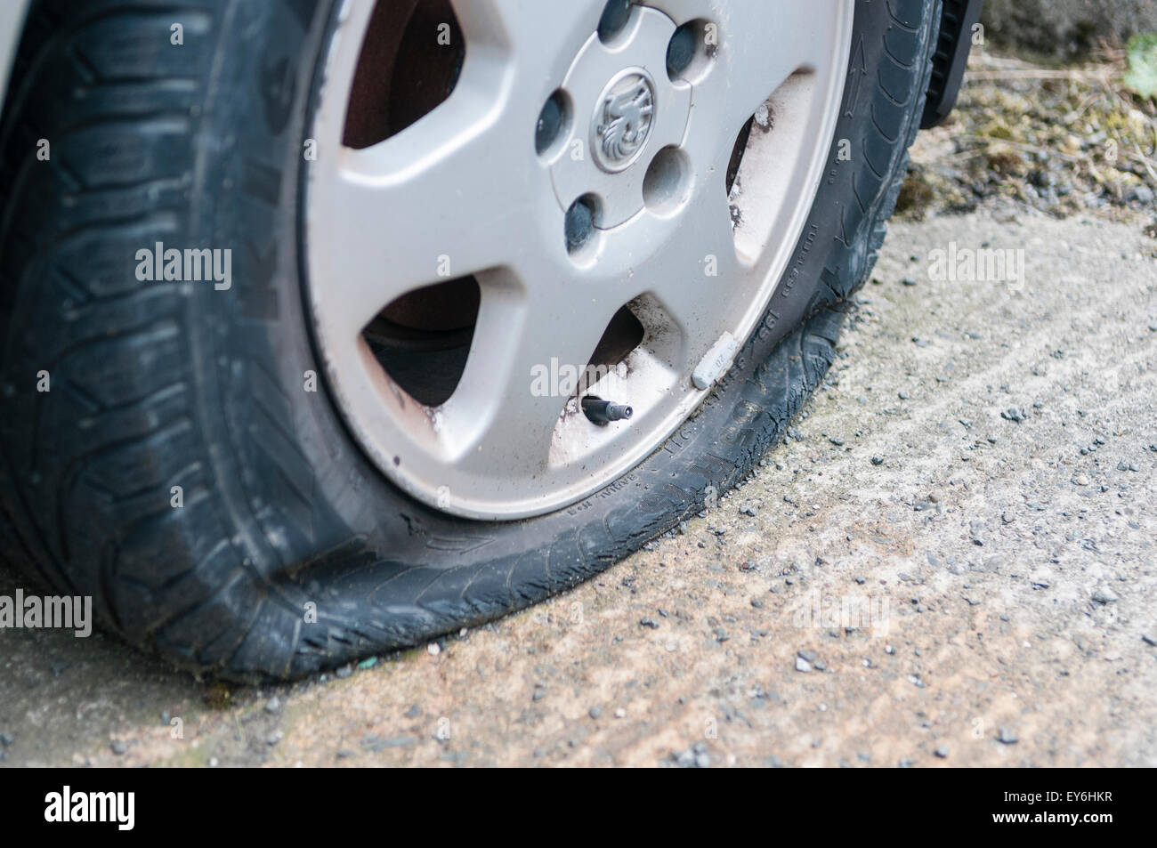 Flat tyre on an abandoned car Stock Photo