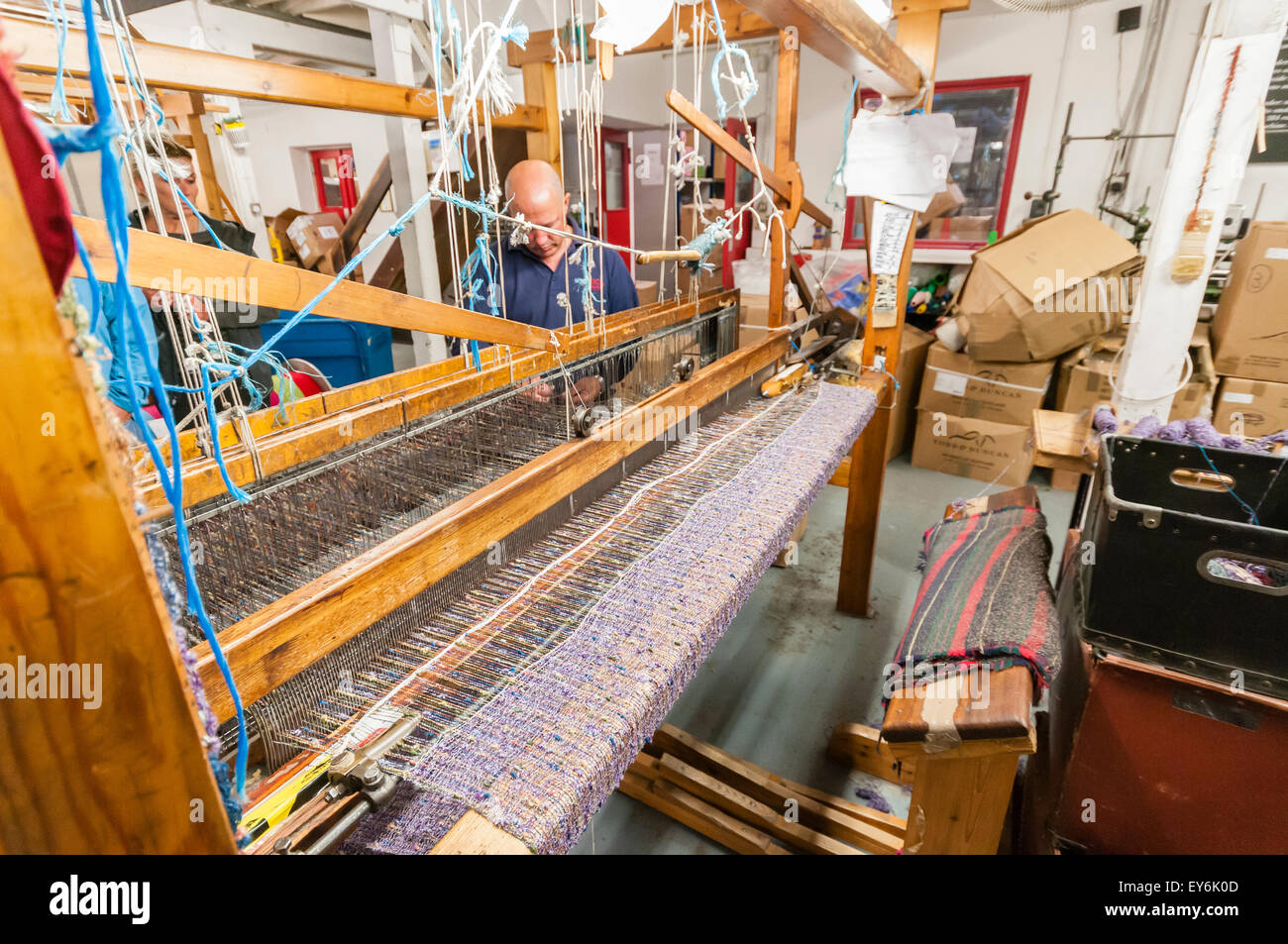 Wool textile cloth being woven on a weaving loom at Avoca Handweavers