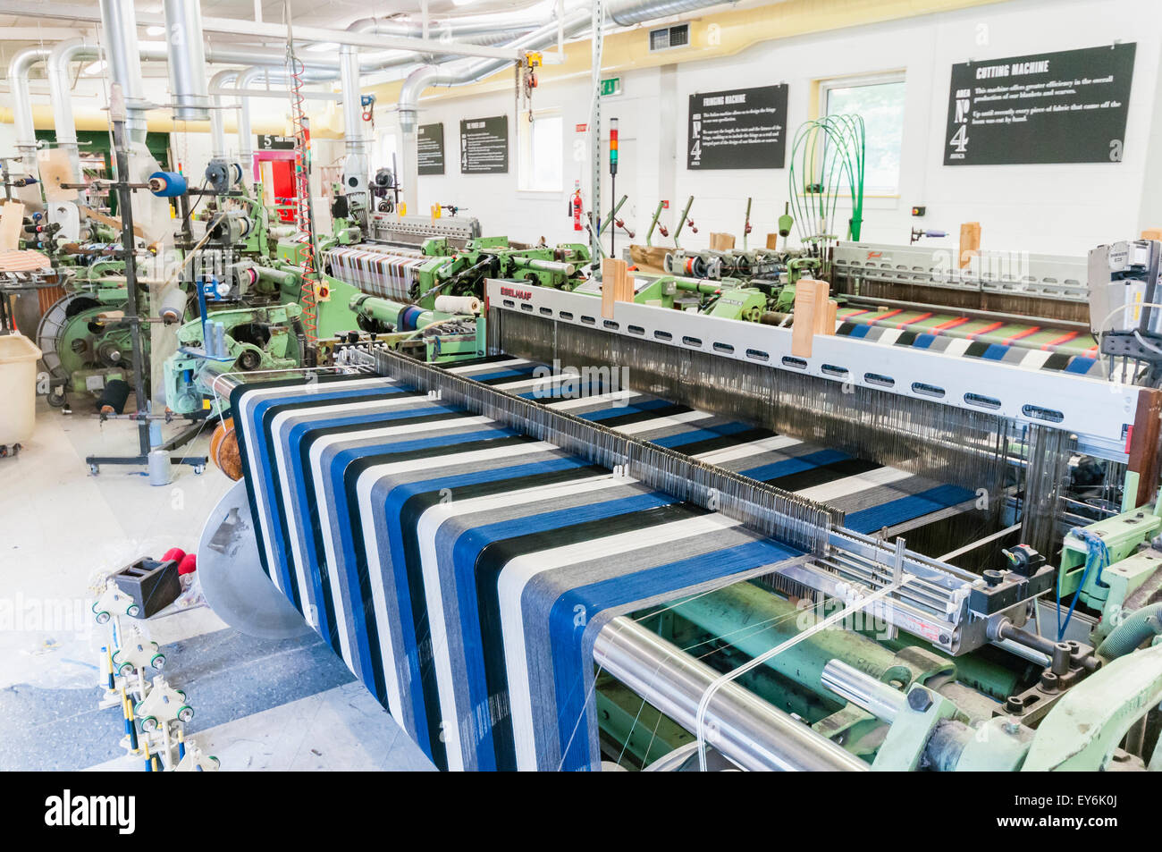 Wool textile cloth being woven on a weaving loom at Avoca Handweavers