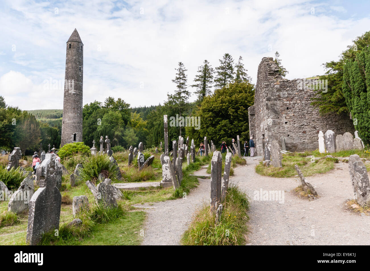 Ancient monastic Roundtower at Glendalough Graveyard, Ireland Stock Photo