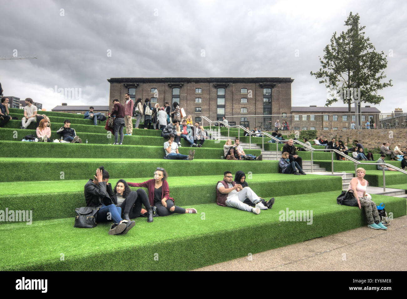 granary Square,   Students sitting by canal.  University of the arts Stock Photo