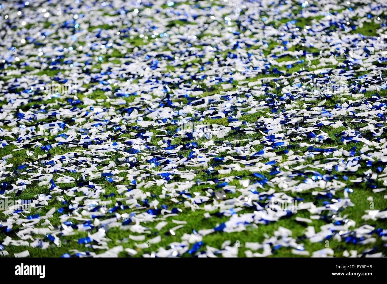 Lots of confetti on a turf soccer field after a celebration moment Stock Photo