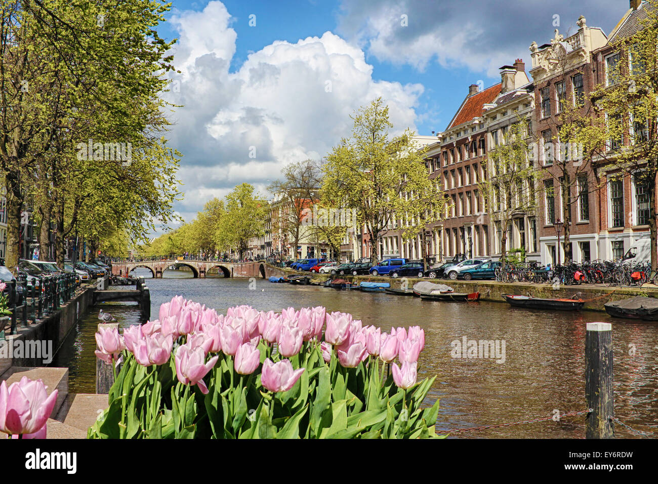Amsterdam canal with boats and typical dutch houses. Stock Photo