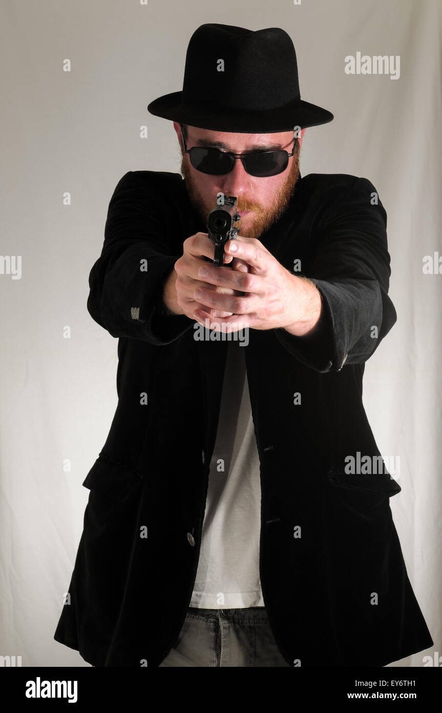 Man Holding a Pistol Gun Stock Photo - Alamy