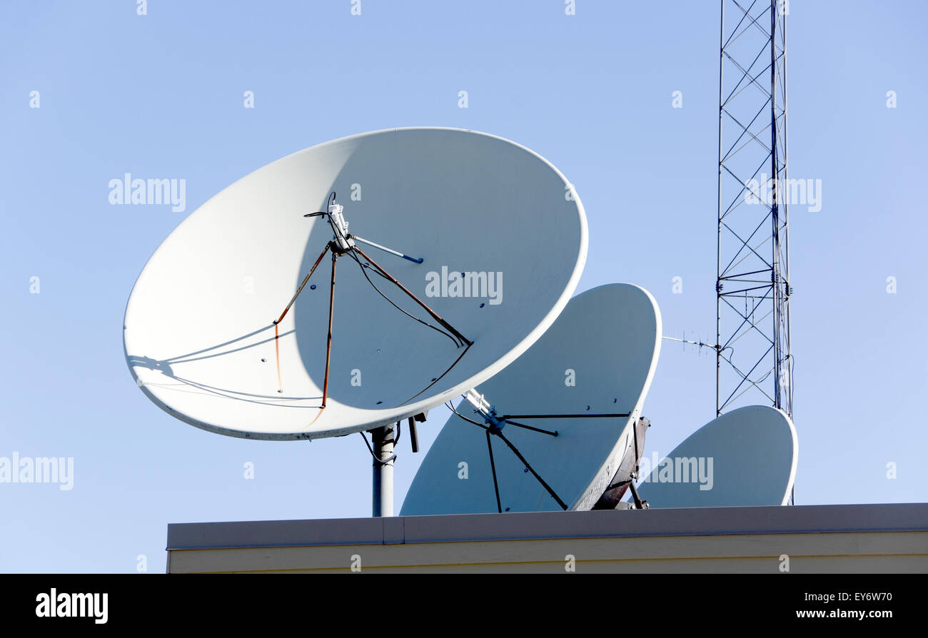 Satellite dish antennae on roof Stock Photo