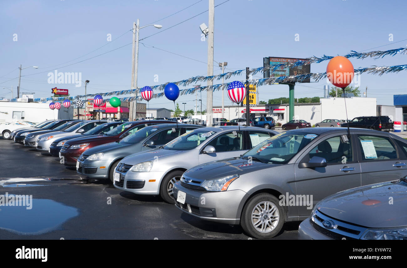 Automobiles lined up in used car lot Stock Photo