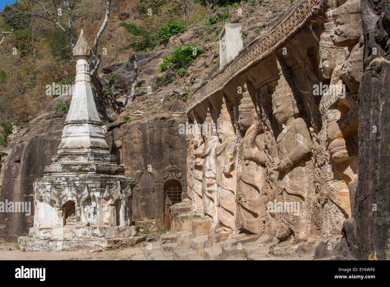 Buddha images are carved in relief from the sandstone hillside Shweba Taung  Cave, Monywa, Myanmar Stock Photo