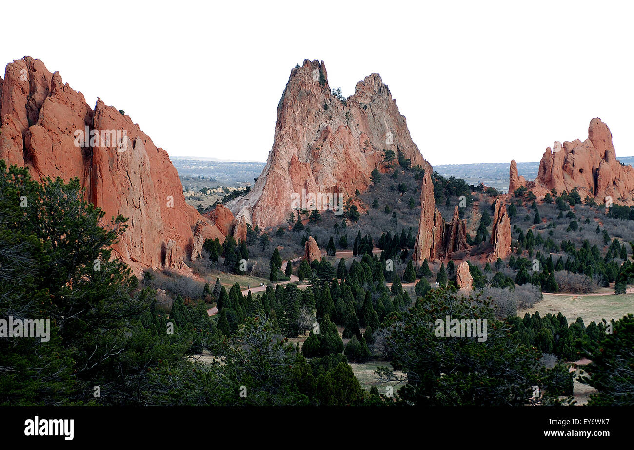 Ancient red sandstone rock formations in the central valley of the Garden of the Gods. The Garden of the Gods is one of the most popular city parks in the United States and offers urban hiking, rock climbing, horseback riding and cycling within just a few minutes of the city of Colorado Springs, Colorado. Stock Photo