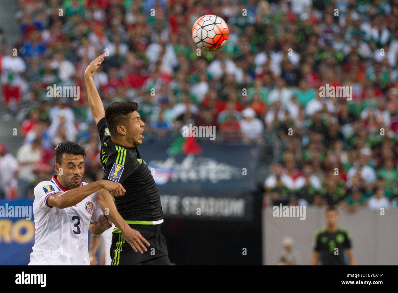 Extra Time. 19th July, 2015. Mexico forward Oribe Peralta (19) strikes a pose as he reacts to heading a ball over Costa Rica defender Giancarlo Gonzalez (3) during the quarter-finals of The CONCACAF Gold Cup match between Mexico and Costa Rica at Met Life Stadium, East Rutherford, NJ. Mexico defeated Costa Rica 1-0 in the final minute of extra time. Mandatory Credit: Kostas Lymperopoulos/CSM/Alamy Live News Stock Photo