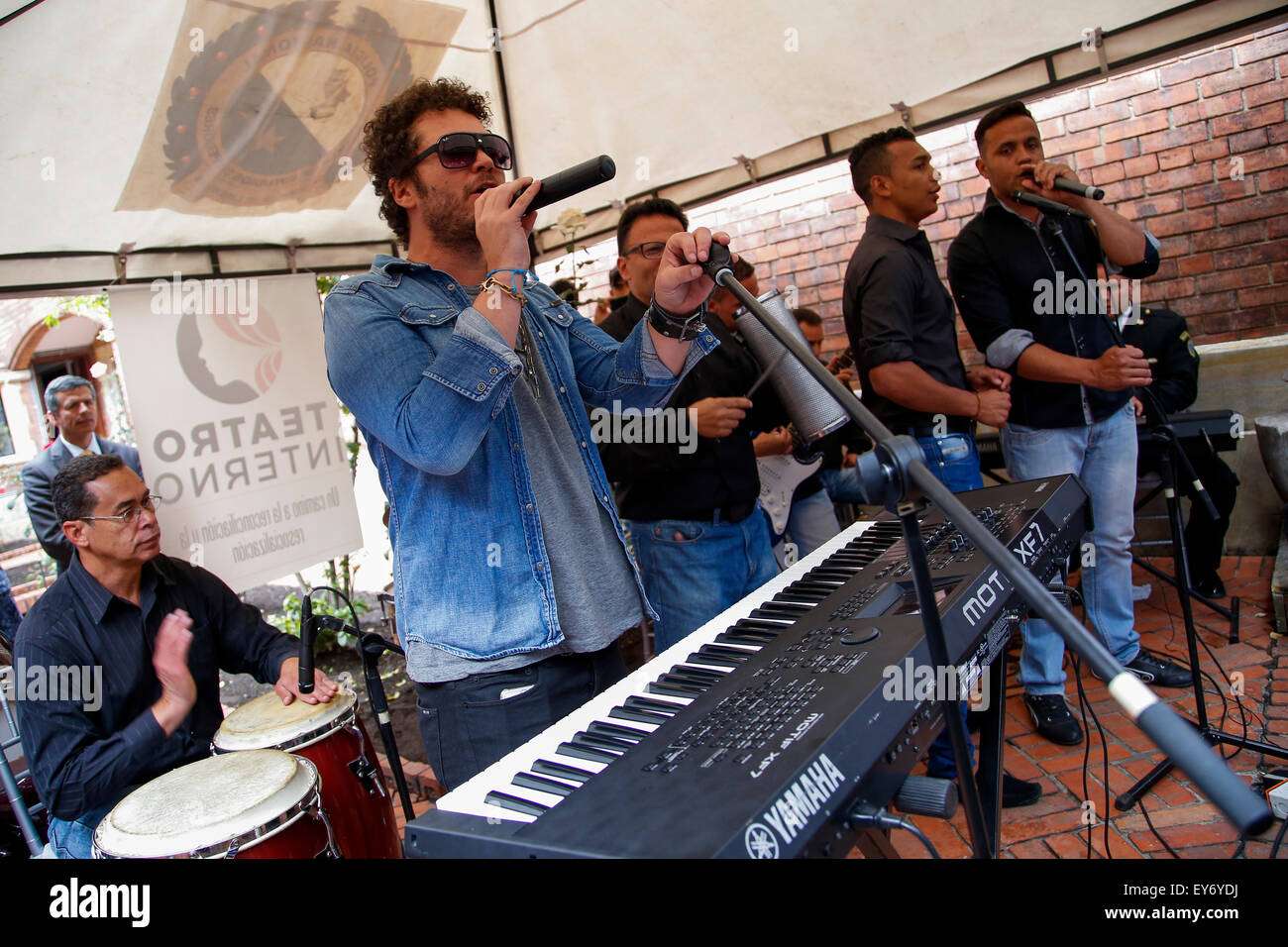 Bogota, Colombia. 22nd July, 2015. Singer Andres Cabas (2nd L, front), and musicians from prisons perform during the inauguration of 'Casa Libertad' (Freedom House), in Bogota, Colombia, on July 22, 2015. 'Casa Libertad', an initiative of the Internal Theater Foundation, the Ministry of Justice and the National Penitentiary and Prison Institute (INPEC, for its acronym in Spanish), is a space for the attention of the Colombian prison population that has left prisons, according to local press. © Mauricio Alvarado/COLPRENSA/Xinhua/Alamy Live News Stock Photo
