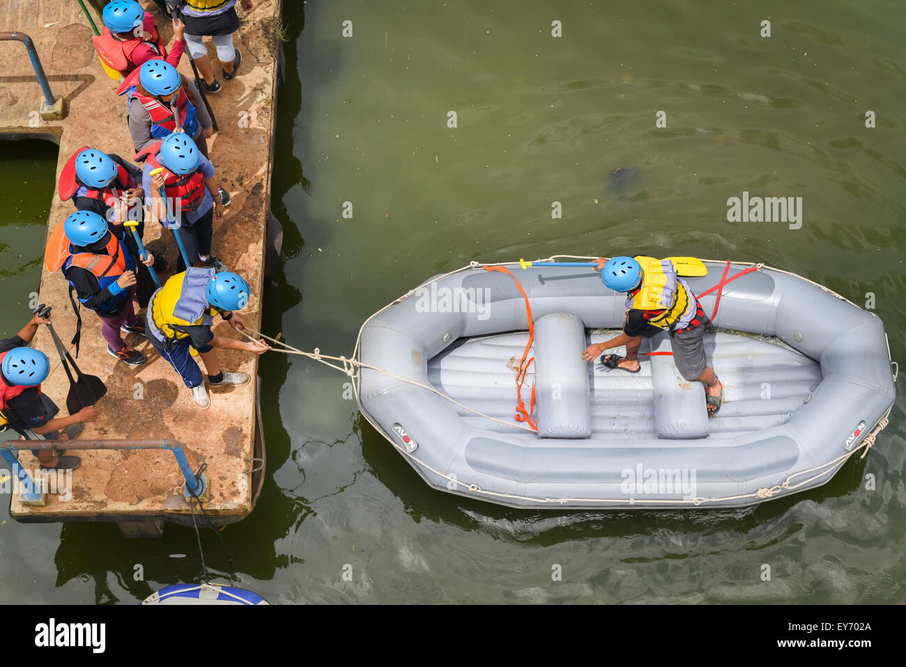 University of Indonesia (UI) students doing preparation for white water rafting training program at UI's campus in Depok, West Java, Indonesia. Stock Photo