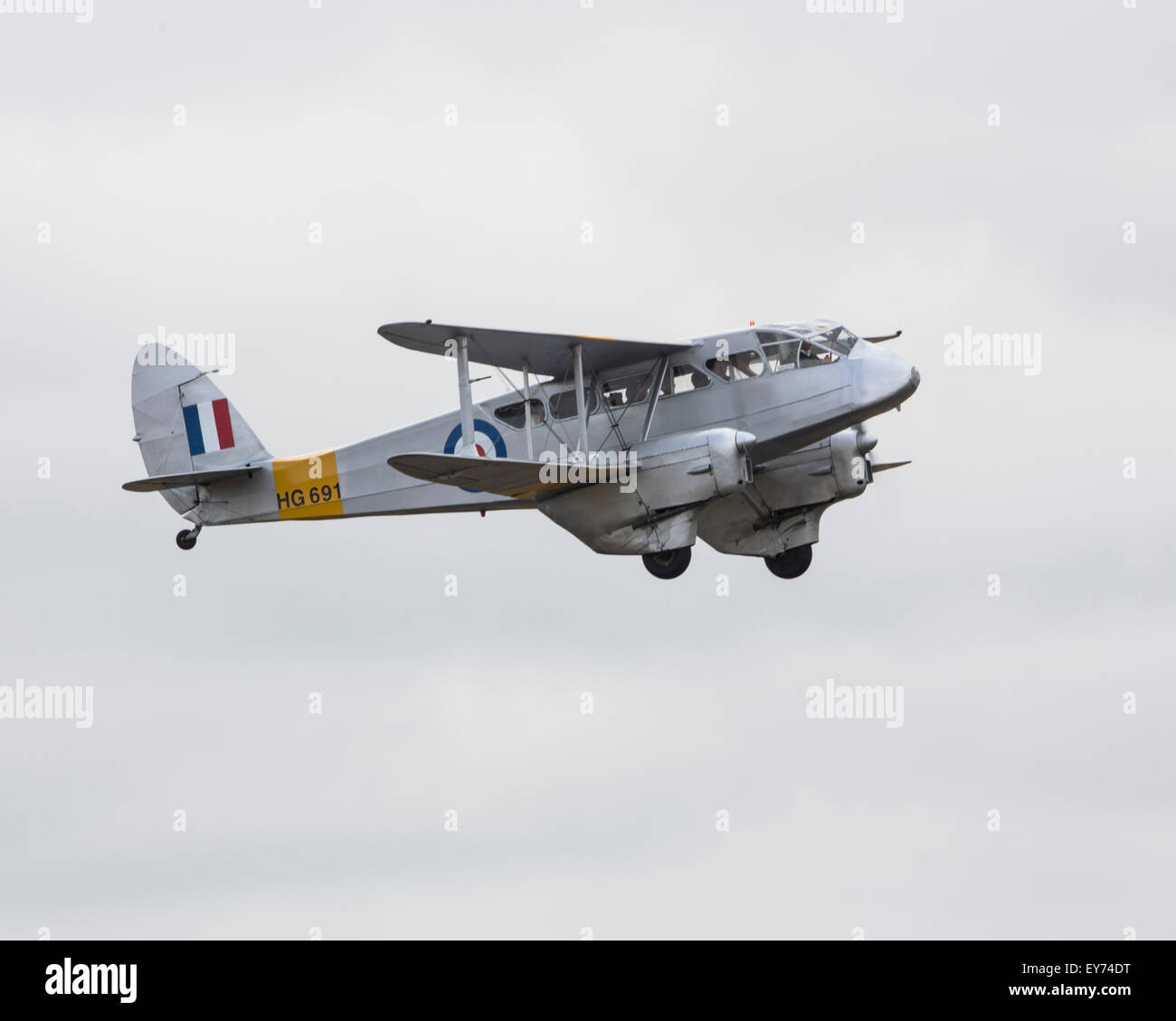 Preserved de Havilland DH.89 Dragon Rapide twin-engined passenger biplane aircraft of the 1930s-1960s flying at the 2015 Flying Stock Photo