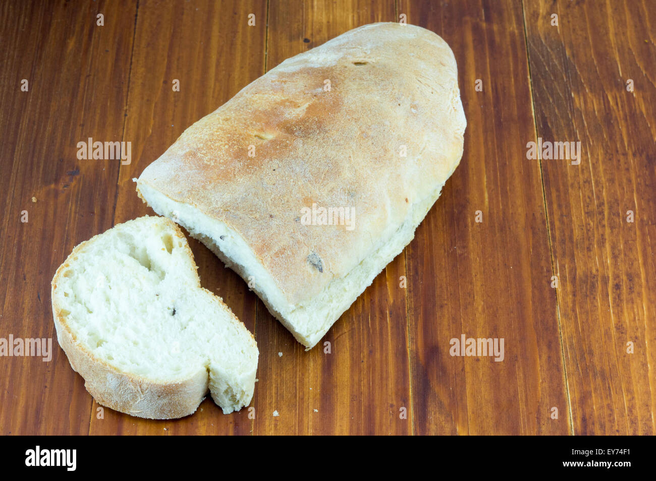 Cut homemade bread on a table Stock Photo