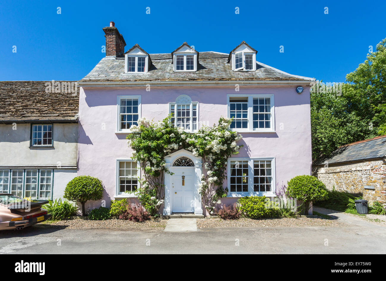 Prime UK real estate Pretty pink town house property with white roses