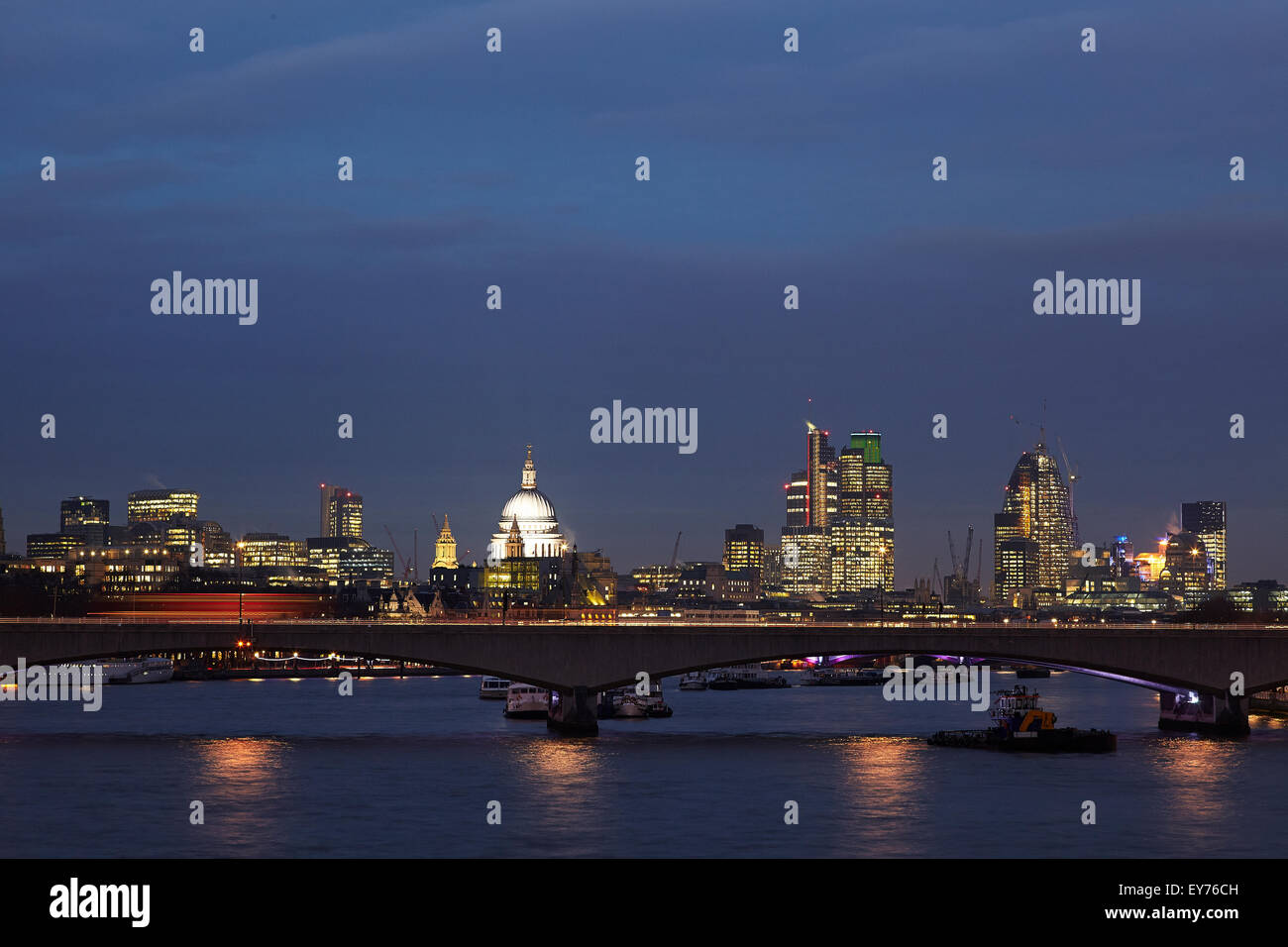 Night scene of the river Thames looking over Waterloo bridge and on to St Pauls and the City of London Stock Photo