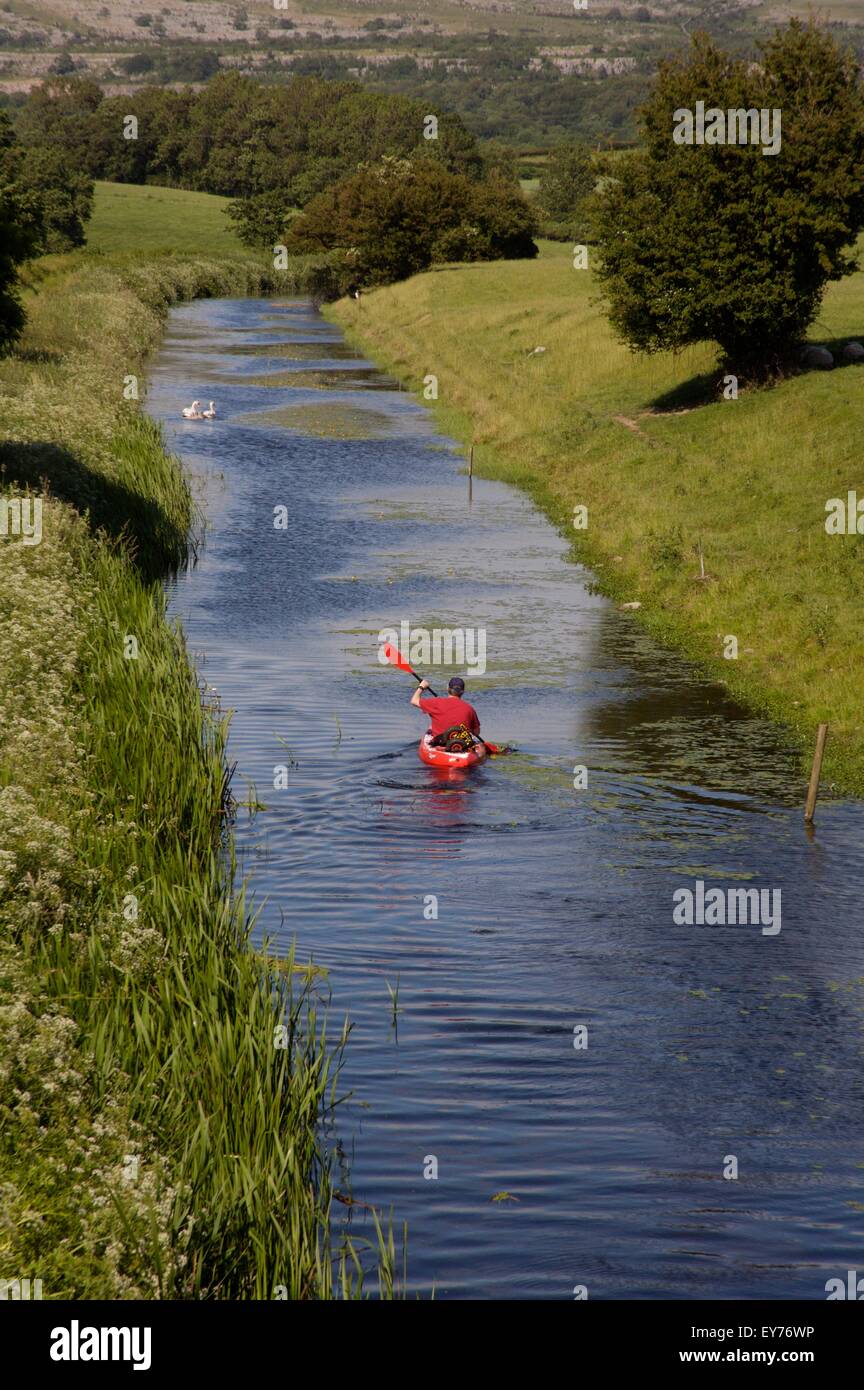 Kayaking on the northern reaches of the Lancaster Canal, not navigable by narrowboats. Cumbria, England. Stock Photo