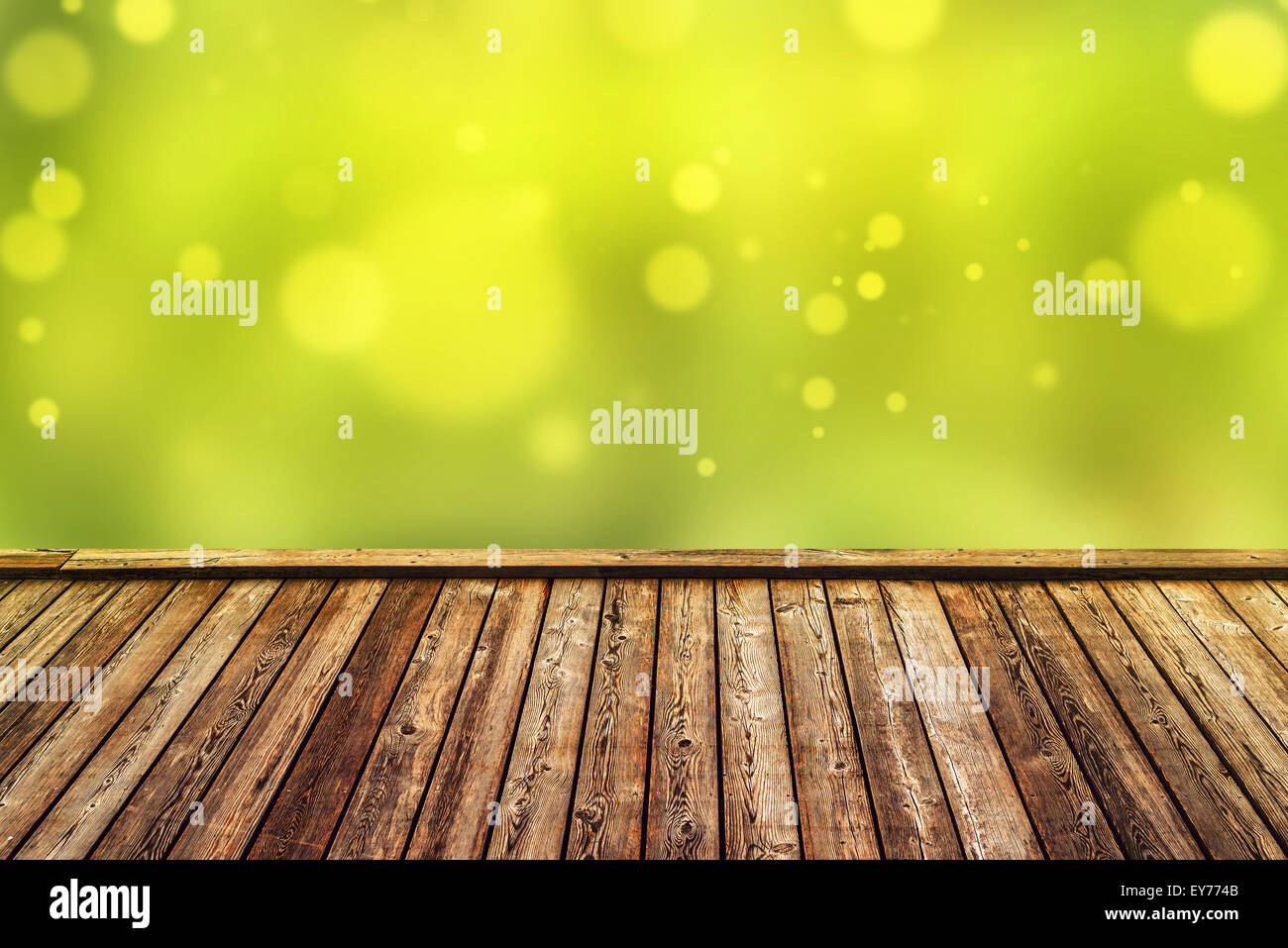 Empty Rustic Wooden Deck with Abstract Blur Natural Background for Product Placement Backdrop Stock Photo