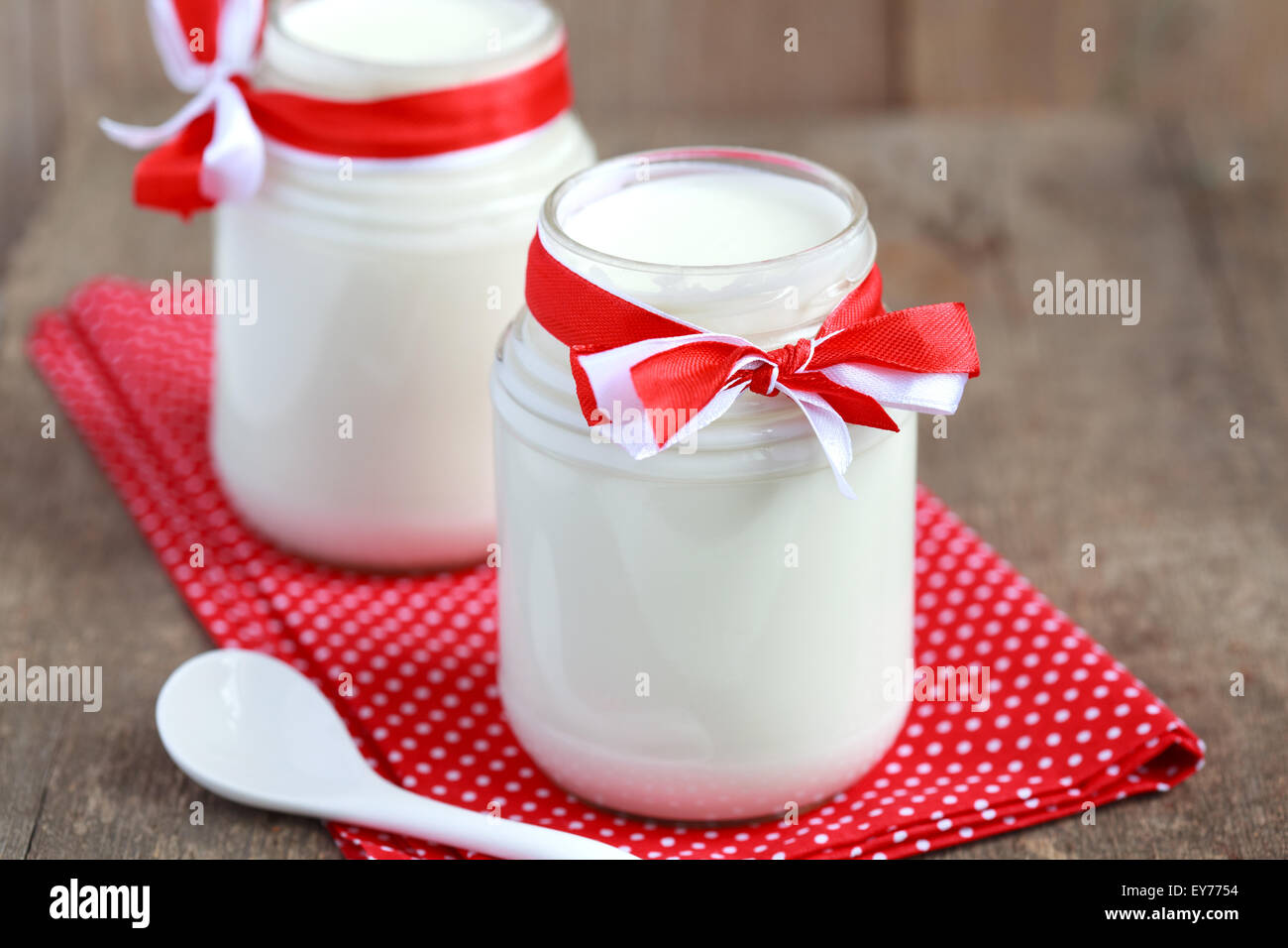 Homemade Yogurt In Two Small Glass Jars On A Wooden Table With Red Cloth Selective Focus Stock Photo Alamy