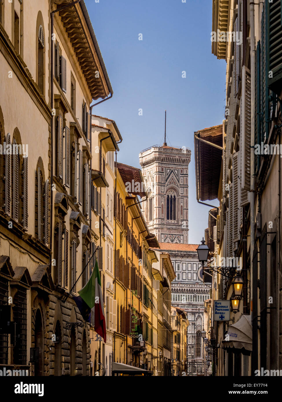 Giotto's Campanile glimpsed between buildings in the city of Florence, Italy. Stock Photo