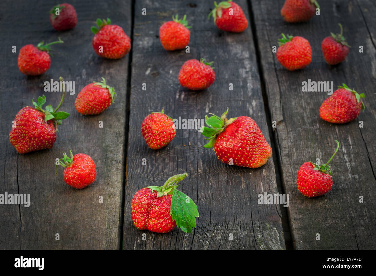 Fresh red strawberries on old wooden table Stock Photo - Alamy