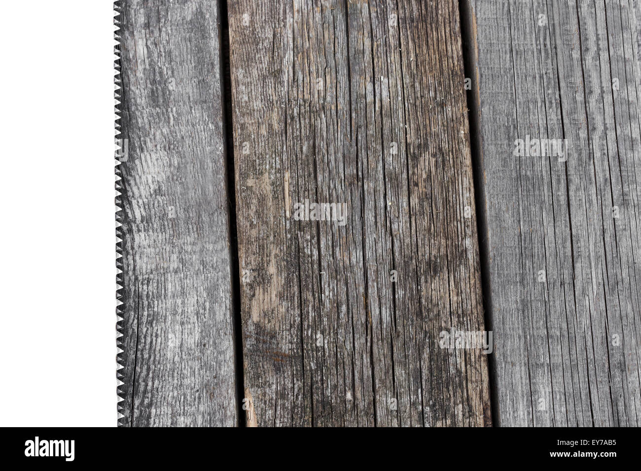 Handsaw and  measuring tape on a wooden board with copyspace, closeup Stock Photo
