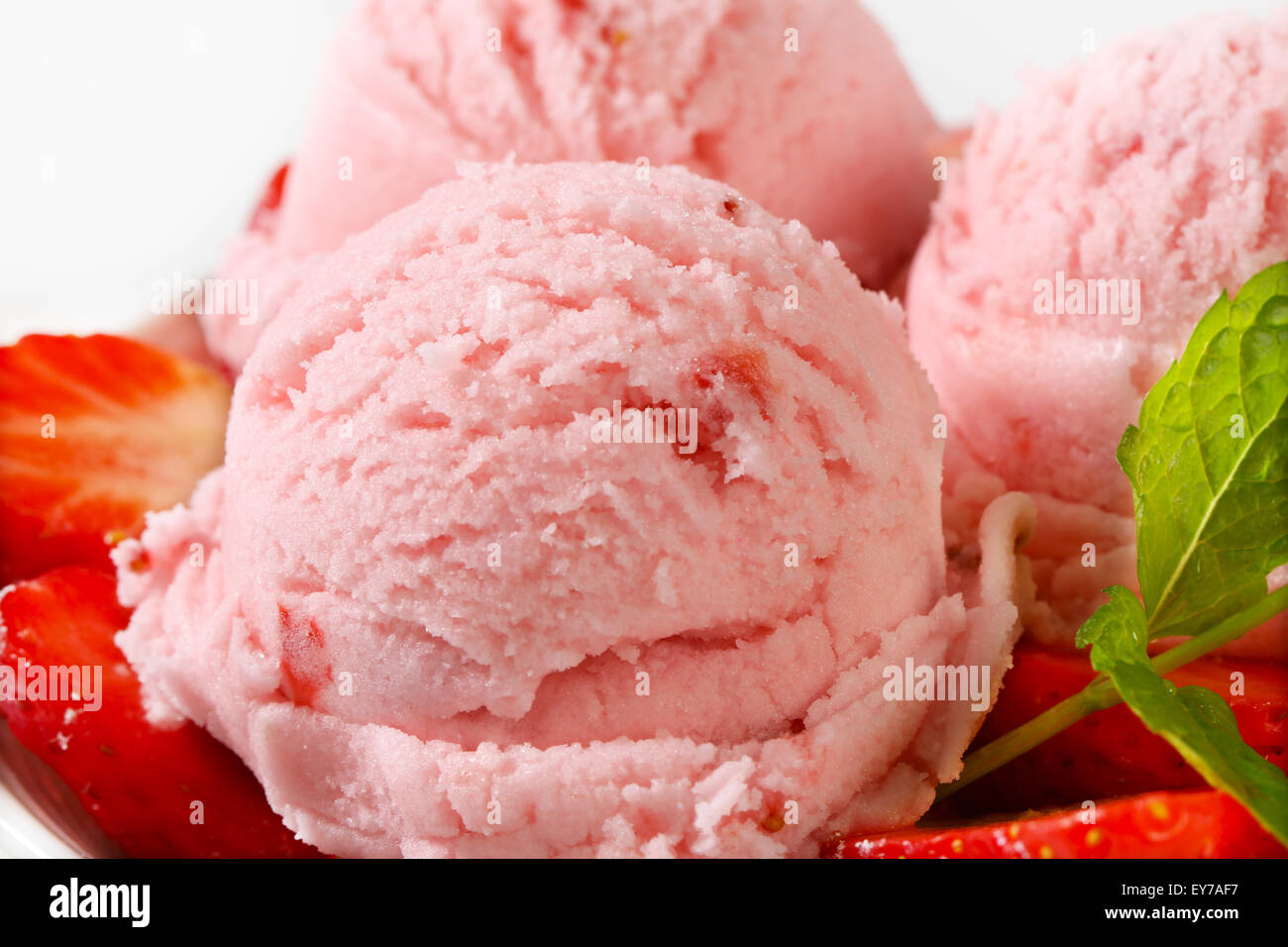Scoops of strawberry sherbet with fresh fruit Stock Photo