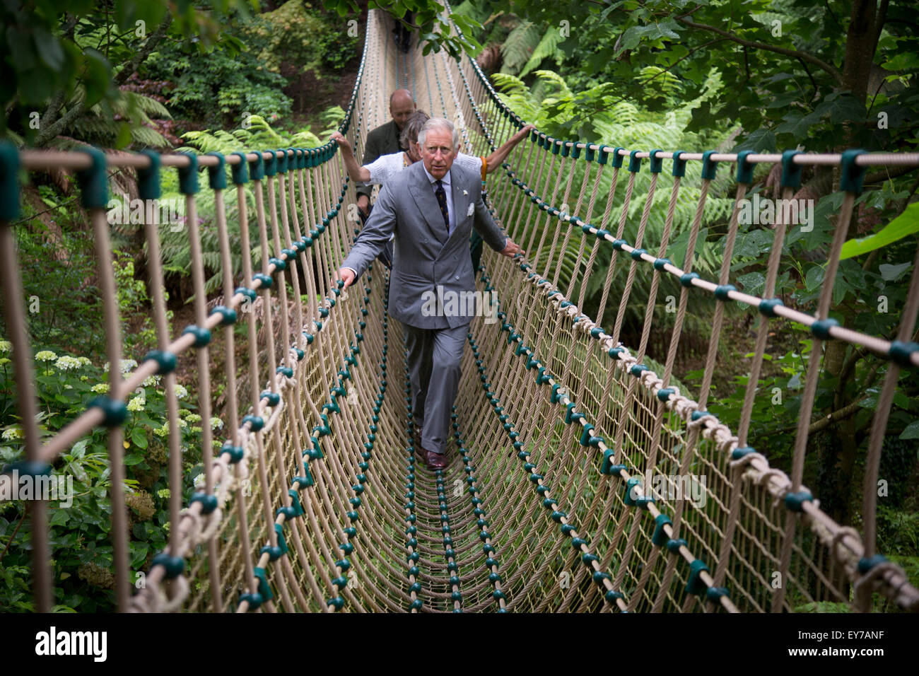 Britain's Prince Charles , The Prince of Wales, crosses the longest rope bridge in the UK at The Lost Garden's of Heligan near Mevagissey in Cornwall Stock Photo