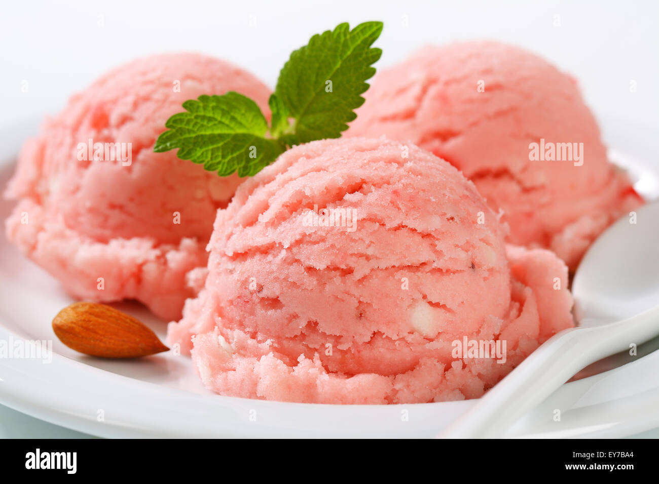 Three scoops of strawberry sorbet Stock Photo