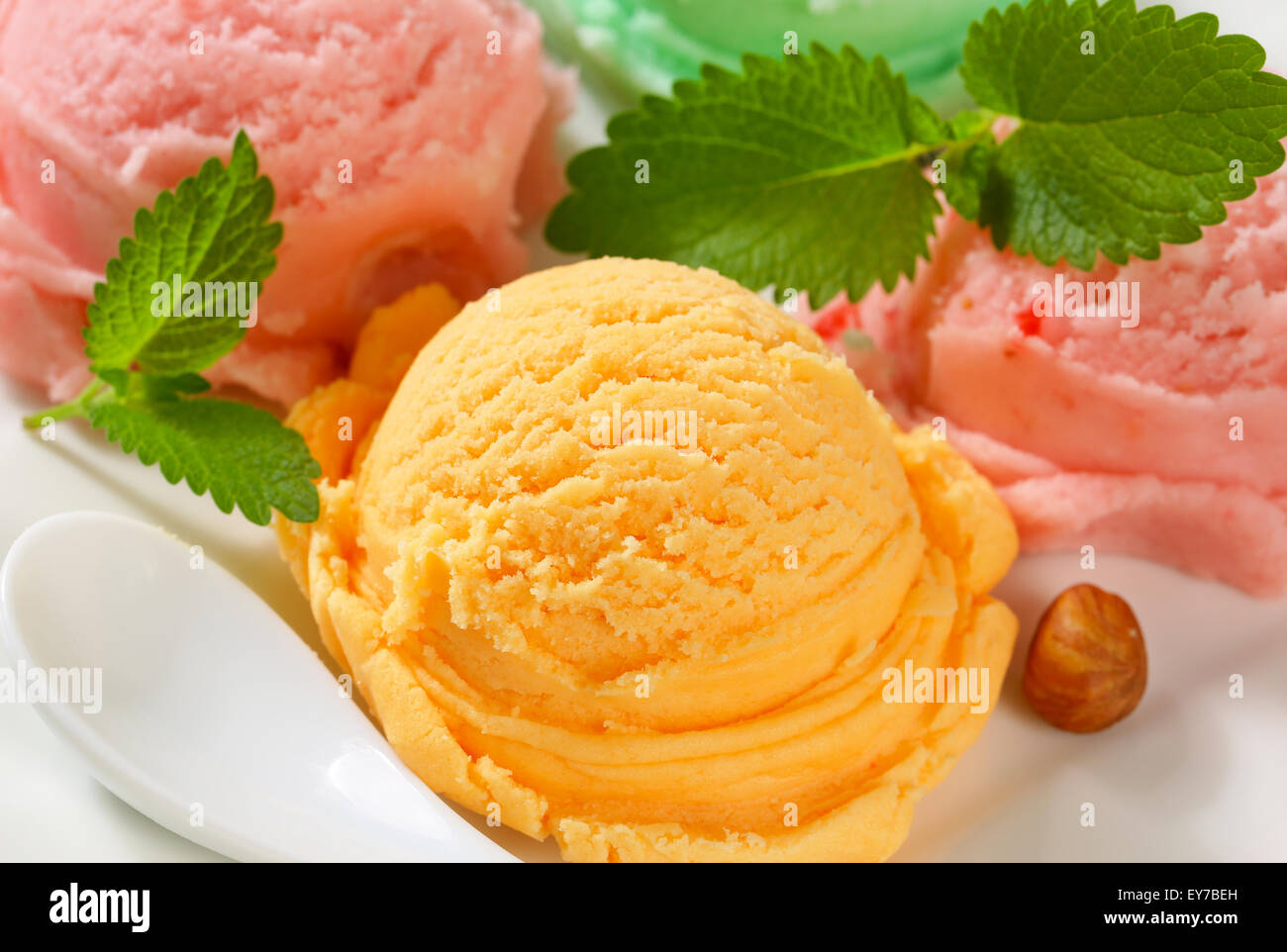 Scoops of ice cream on plate Stock Photo Alamy