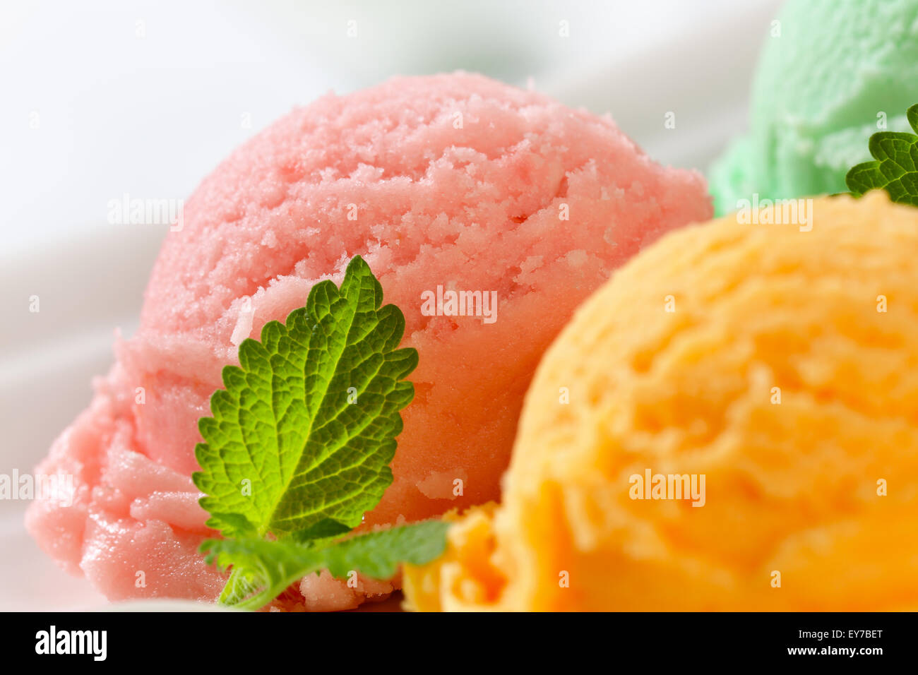 Scoops of ice cream on plate Stock Photo Alamy