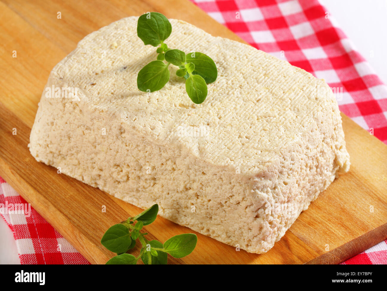 Block of homemade tofu on cutting board Stock Photo Alamy