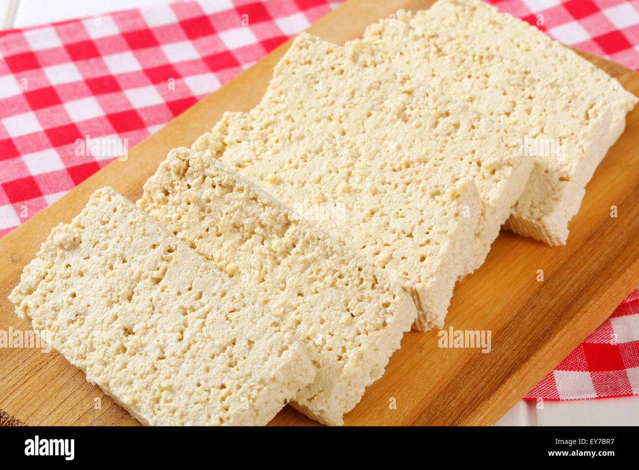 Slices of homemade tofu on cutting board Stock Photo Alamy
