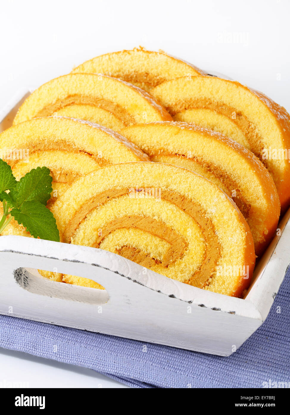 Slices of Swiss roll cake with mocha almond filling Stock Photo