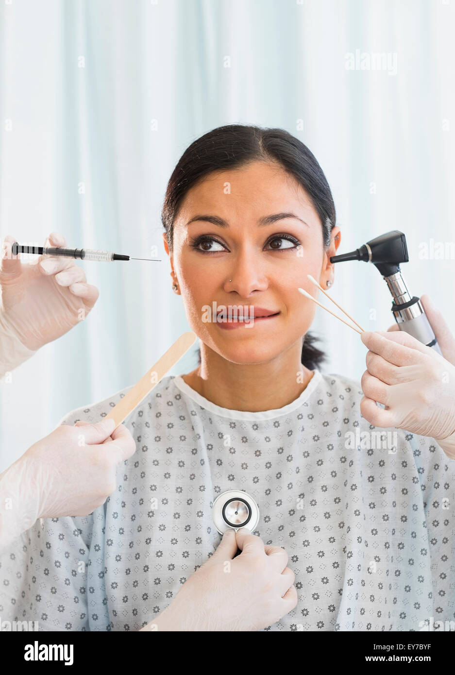 Patient being examined using medical instruments Stock Photo