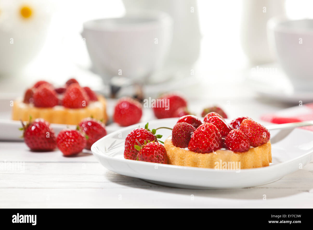 Strawberry shortcake on coffee table, shallow depth of field Stock Photo