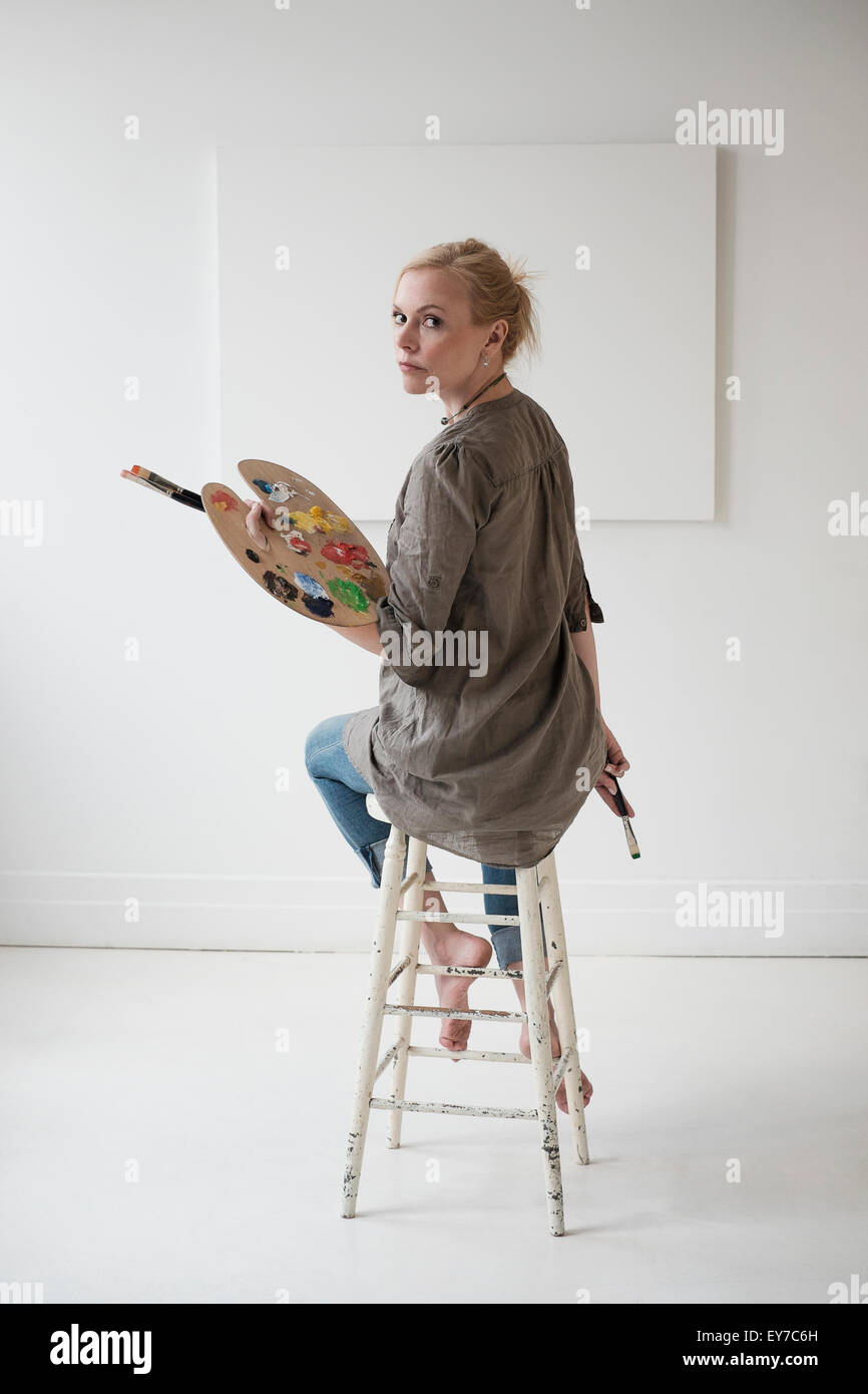 Female artist painting in studio Stock Photo