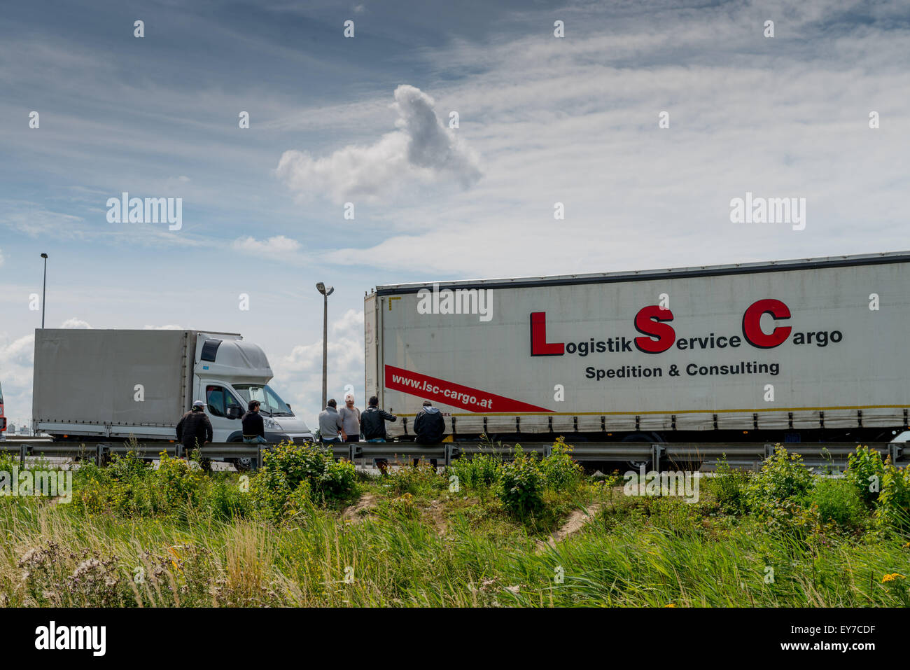 Calais, France. 23rd July, 2015. Hundreds of migrants from across the ...