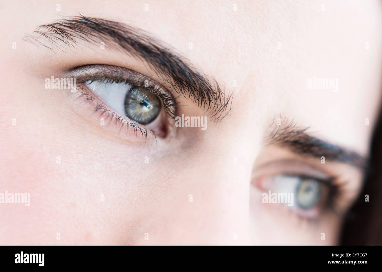 Portrait of young woman with blue eyes Stock Photo
