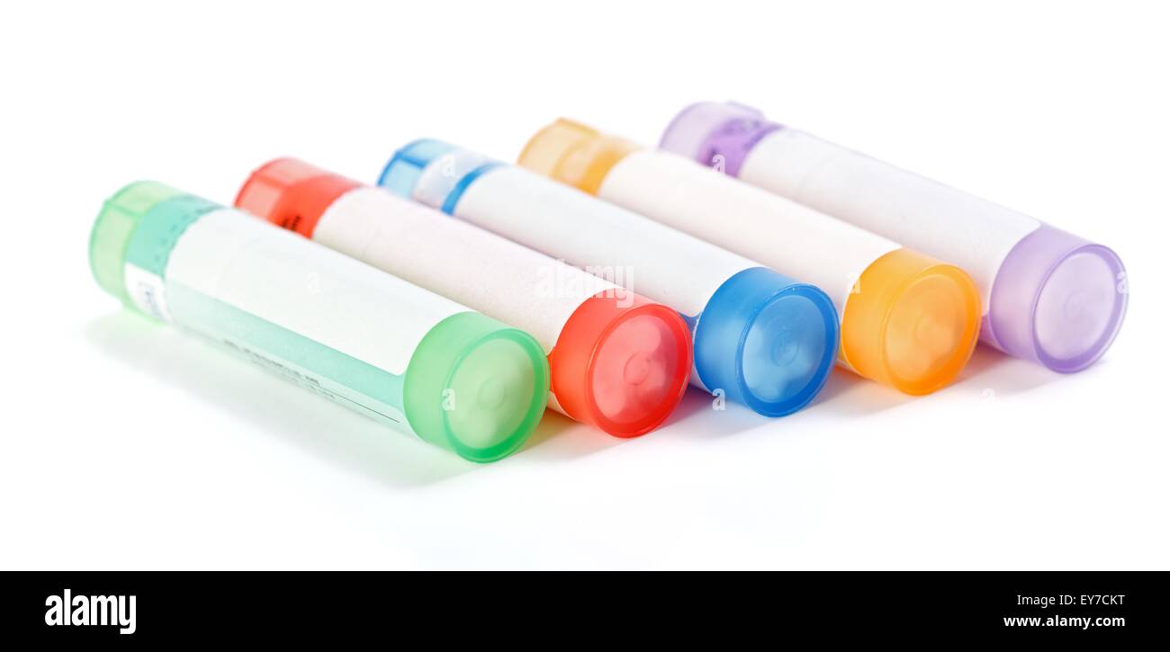 Colorful homeopathic medication containers on white Stock Photo
