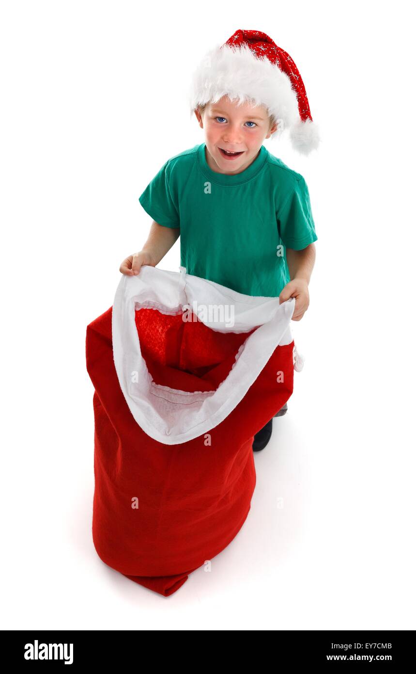 Happy little child holding open Santa sack Stock Photo