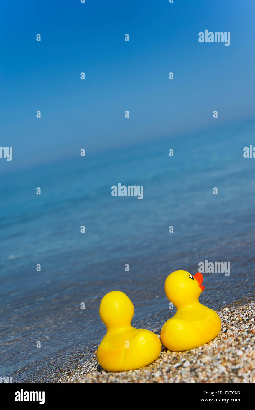 Two rubber duckies on Aegean shores Stock Photo