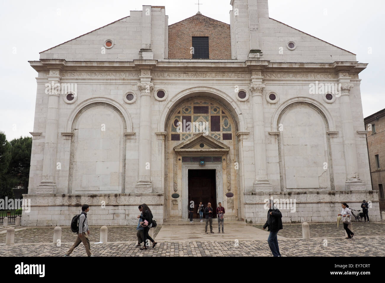 Pedestrians in front of the Malatesta Temple, Rimini. Stock Photo